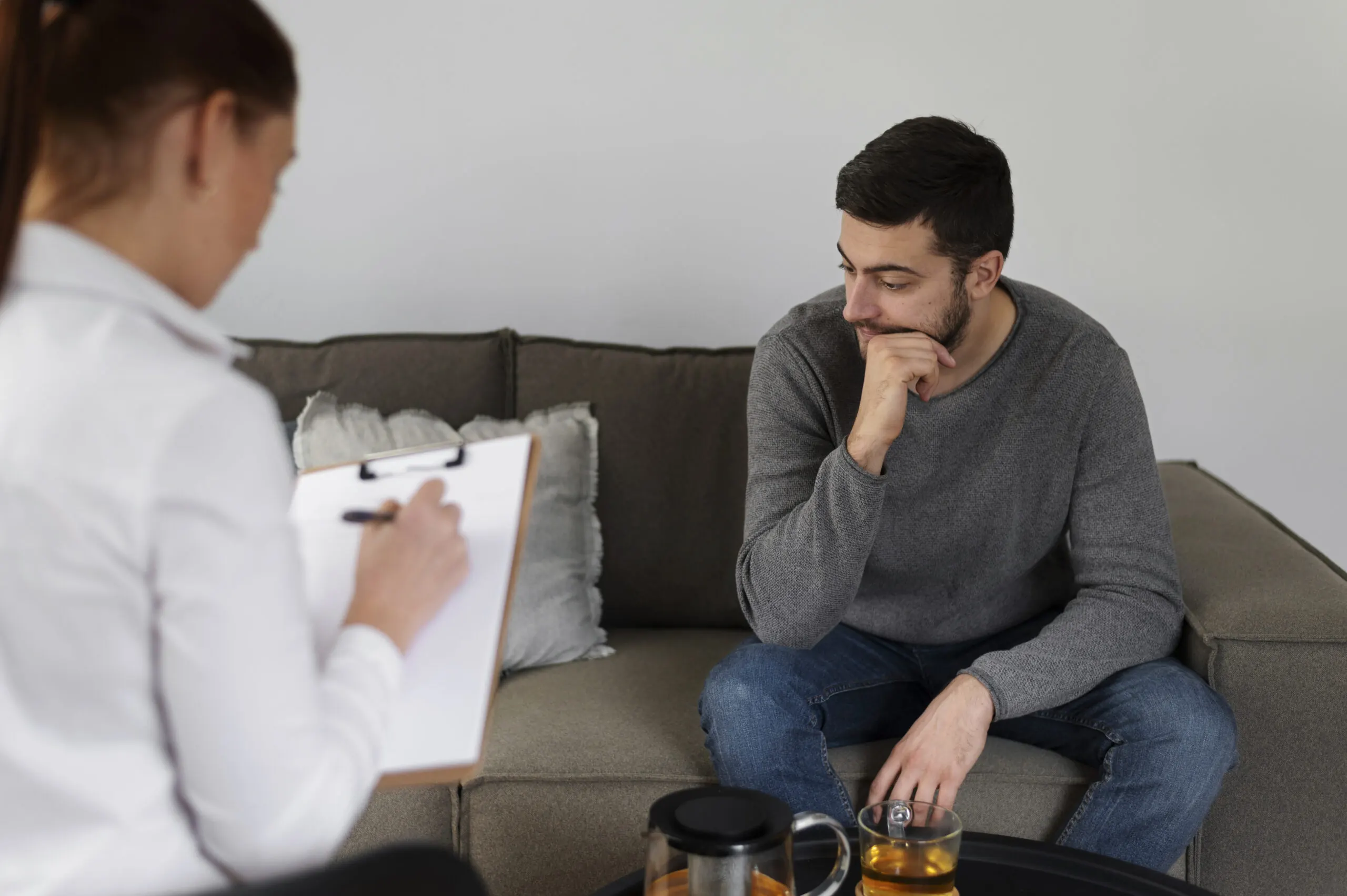 Man discussing mental health concerns with a therapist