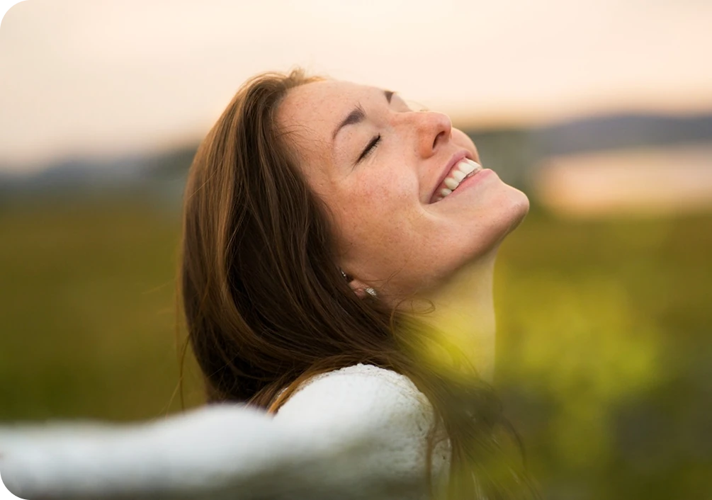 Woman feeling renewed after TMS therapy in Kalamazoo