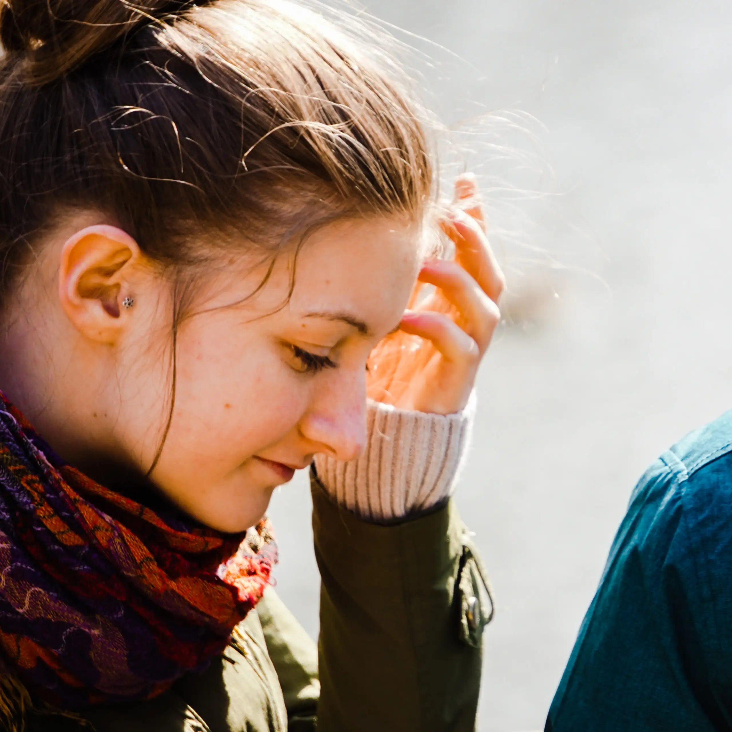 Young woman receiving compassionate support for emotional distress